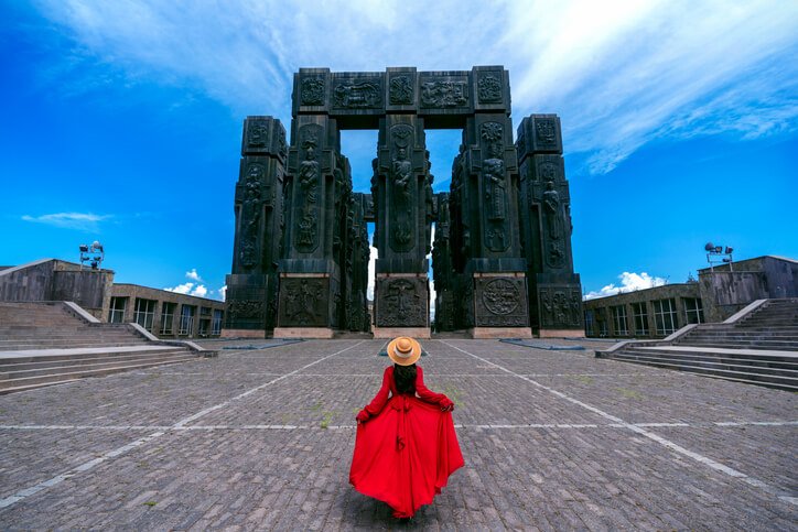 Tourist girl visiting at Chronicle of Georgia in Tbilisi, Georgia.